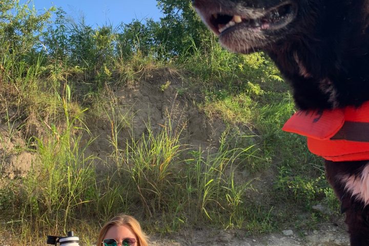 a woman sitting on a boat looking at the camera